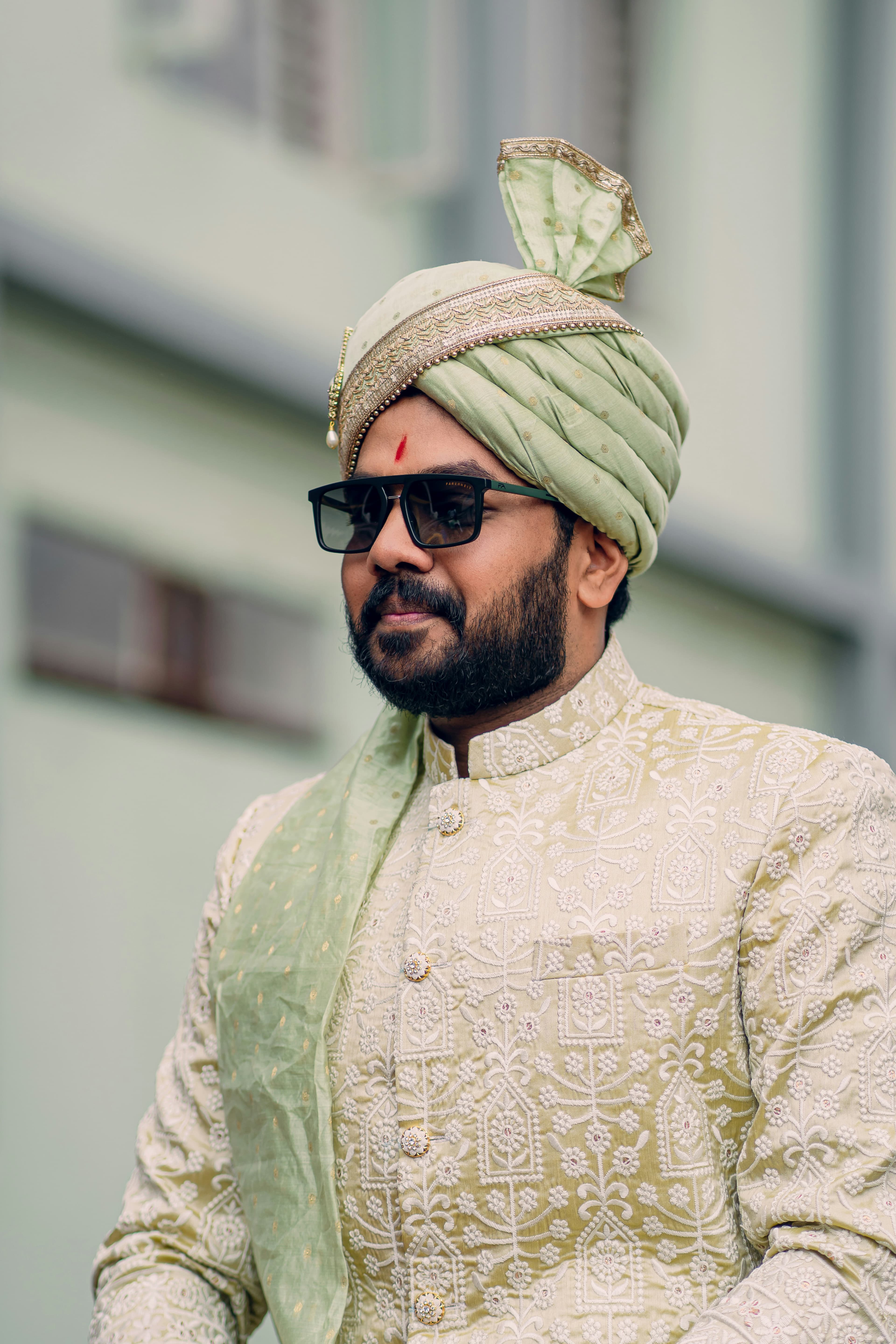 Groom in a pistachio chikankari sherwani with a safa