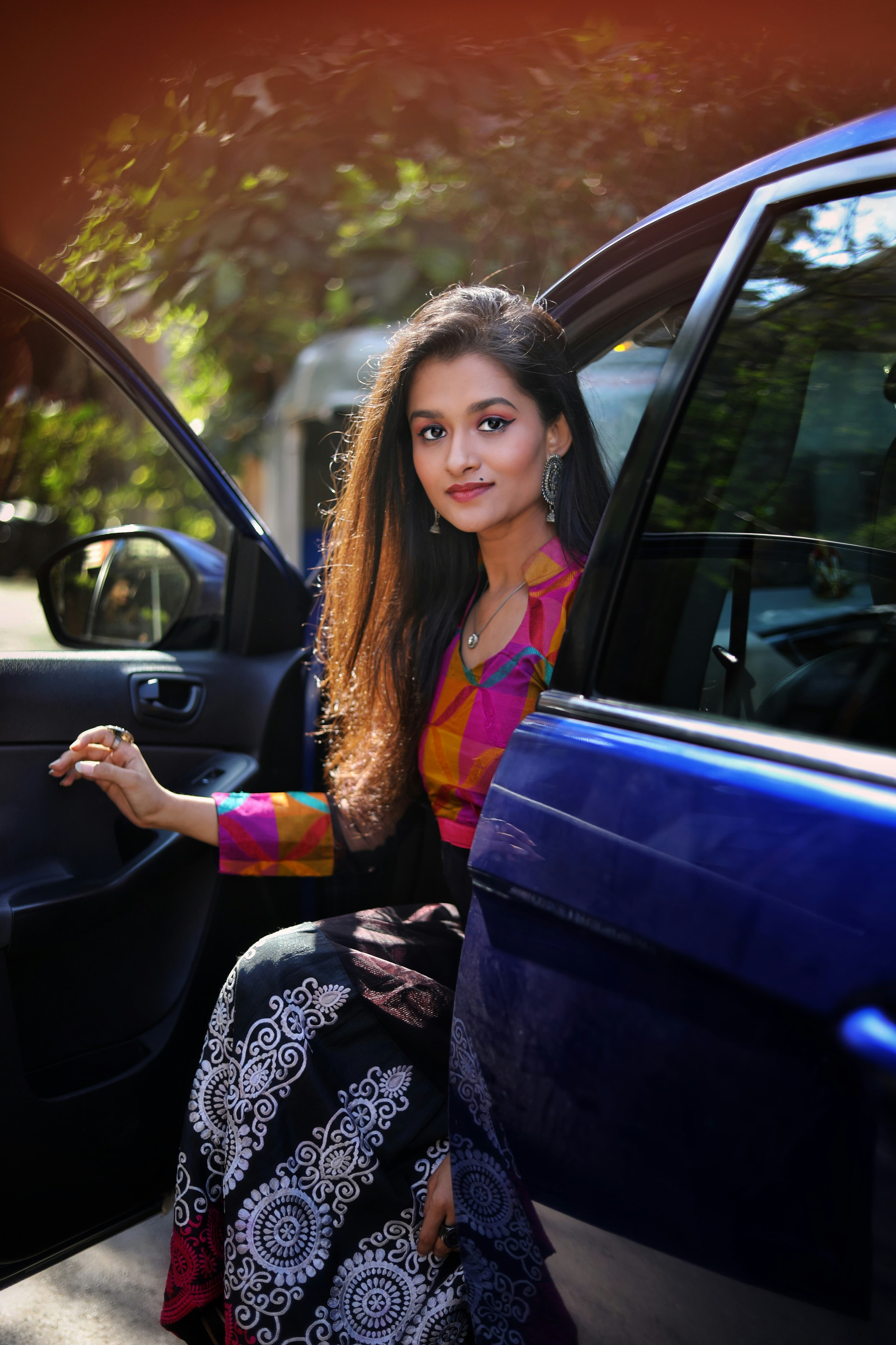 Woman in a multicolour silk-patch kurti with embroidered skirt