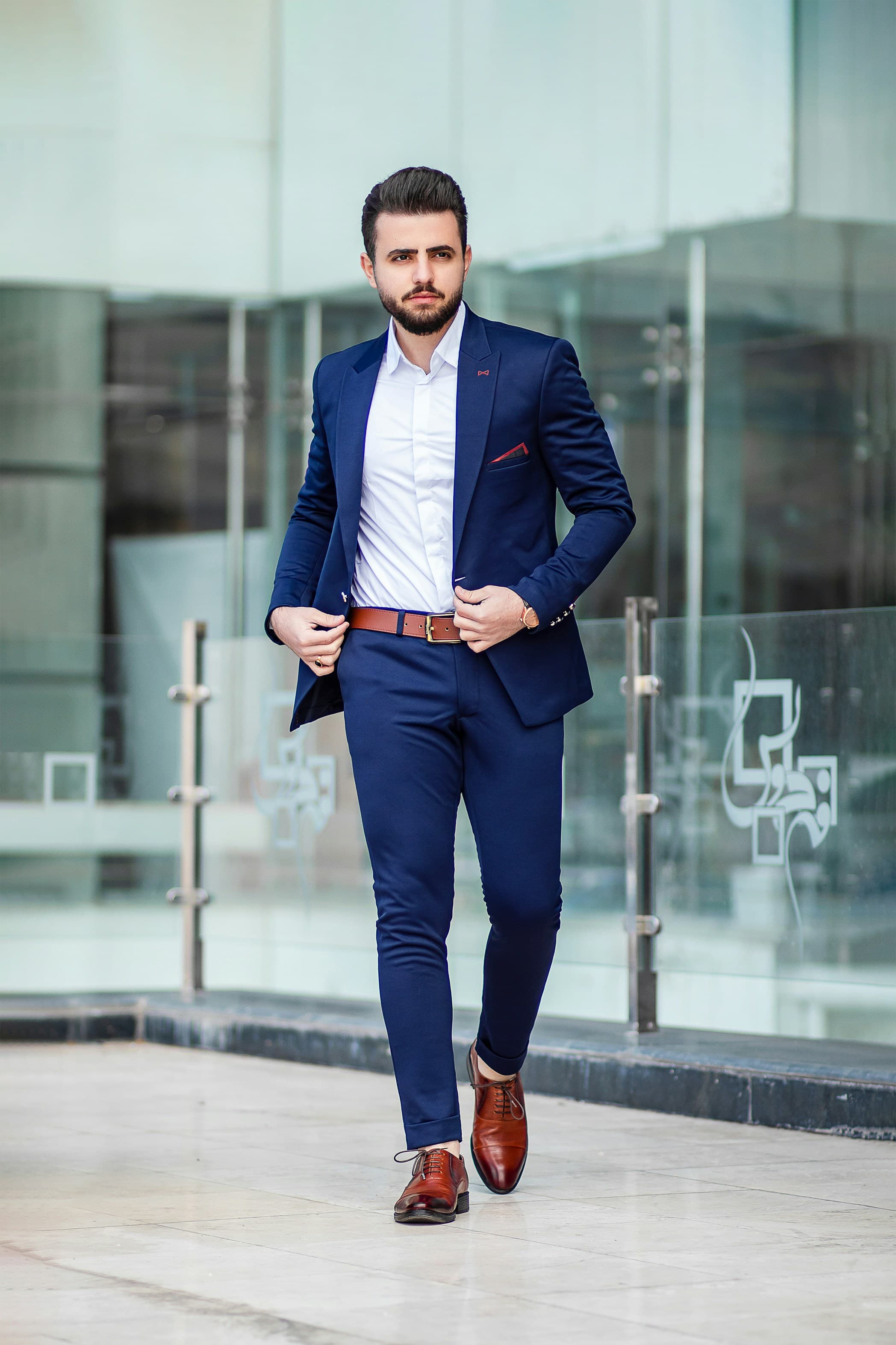 Man wearing tapered grey formal trousers